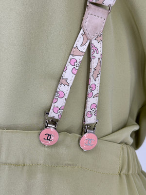 Chanel *Rare* printed suspenders with pink enamel CC logo clips — includes Chanel box