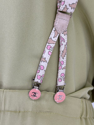 Chanel *Rare* printed suspenders with pink enamel CC logo clips — includes Chanel box