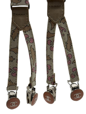Chanel *Rare* printed suspenders with pink enamel CC logo clips — includes Chanel box