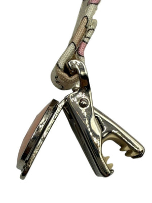 Chanel *Rare* printed suspenders with pink enamel CC logo clips — includes Chanel box